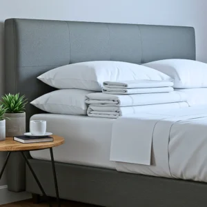 hotel bed sheets stacked